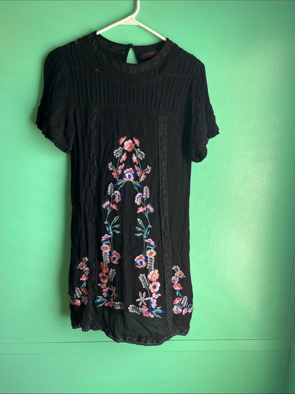 Black short dress with colorful embroidered flowers